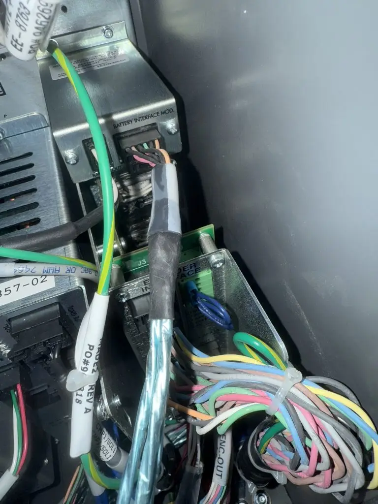 Jeff Smeker troubleshooting FANUC robot solenoid wiring during rotor system startup in North Carolina
