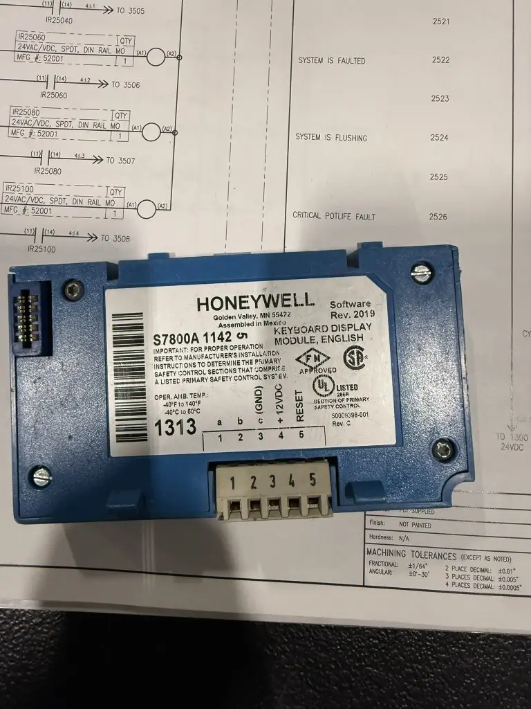 Faulty Honeywell flame safety relay removed during oven startup testing in rotor coating system