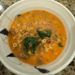 Spicy creamy Italian sausage and spinach ditalini soup with parmesan cheese in a bowl