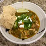 Green chicken chili with roasted tomatillos, guajillo pepper, white beans, and fresh cilantro